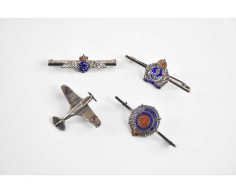 An RAF white metal and enamel sweetheart brooch, with three further military brooches including Royal Navy and a model of a S