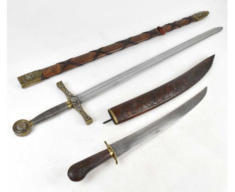A modern 'Excalibur', with scabbard, and an Indian dagger, with carved handle and scabbard (2).