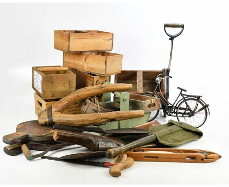 An assortment of collectors' items including vintage advertising wooden boxes, a US Army trench spade with canvas pouch, bell