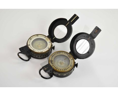 Two military compasses, both marked 'T. G. Co Ltd', both bearing broad arrow, one with leather case (2).