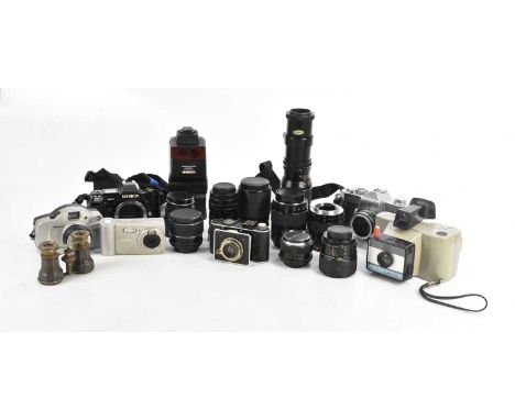 An assortment of vintage cameras and lenses including Prinz Galaxy F=300mm, Polaroid Swinger II, a Foth-Derby camera, etc (qt