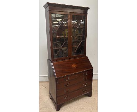 An Edwardian inlaid mahogany bureau bookcase, with two astragal glazed doors and four long drawers, on bracket feet, height 2