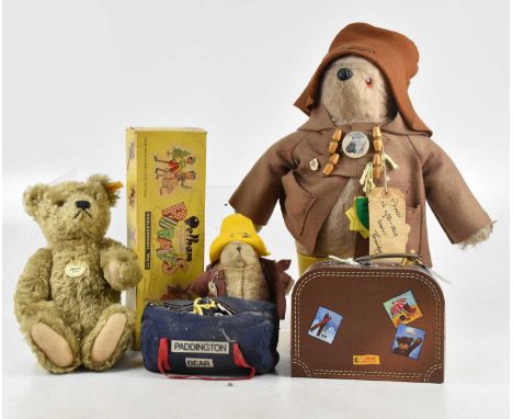 A vintage Paddington Bear with yellow Dunlop Wellington boots, a smaller example, two Steiff bears and a Pelham Puppet clown.