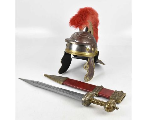 A reproduction Roman officer's centurion helmet and gladius (2).