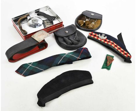 A small collection of uniform items including two Glengarries, a tartan tie, two sporrans, belt, etc.