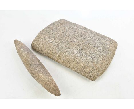 A stone grain grinder, 38 x 27cm.