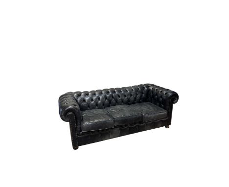 A contemporary black leather Chesterfield style three seater sofa, length 205cm, depth 88cm.
