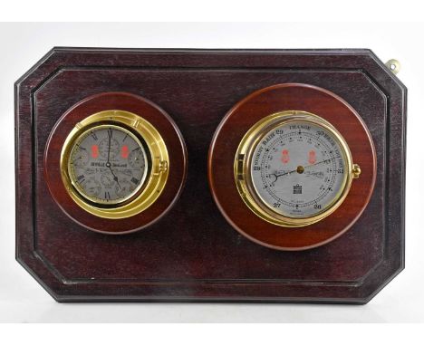 SEWILLS SEALORD; a modern ship's style clock and barometer, mounted on a stained wooden plinth, the clock and barometer with 