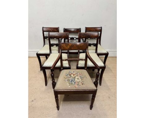 A set of four Regency mahogany bar back dining chairs with drop-in seats and two similar examples including an elbow chair wi