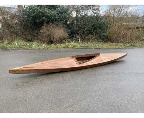 A vintage scratch built canoe, circa 1965, with instructions, length 443cm.