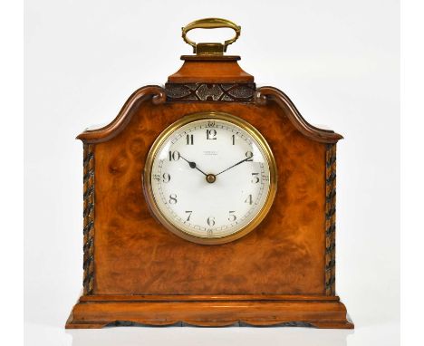RUSSELLS LTD, MANCHESTER; an early 20th century walnut cased mantel clock, with white enamel dial set with Arabic numerals, h