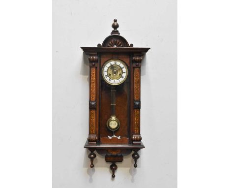 An early 20th century Vienna style wall clock, the enamel dial set with Roman numerals.