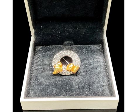This Swarovski brooch is made with high-quality Swarovski crystals that sparkle and shine. The brooch is in the shape of a wr