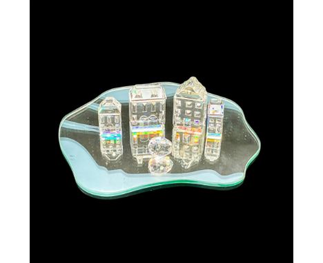 This collection includes 4 houses from the Silver Crystal City collection, a tiny multi-faceted egg, and a mirrored display b