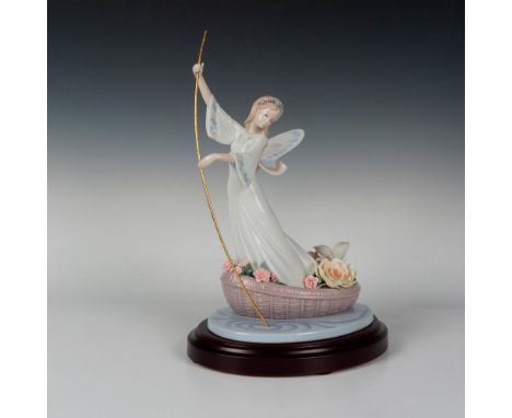 Limited edition glossy finish depicting a woman rowing a boat filled with intricate flowers. Lladro backstamp. This item has 