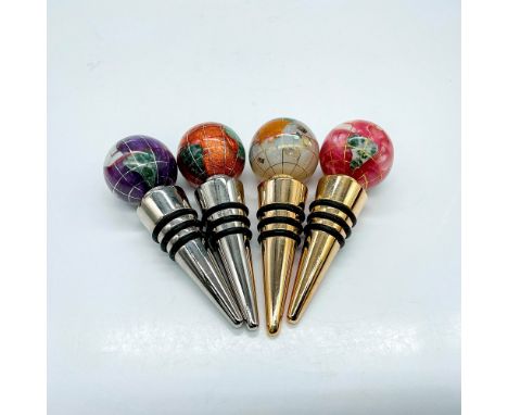 Elevate your wine collection with this set of four handcrafted gemstone globe wine stoppers. These items have their original 
