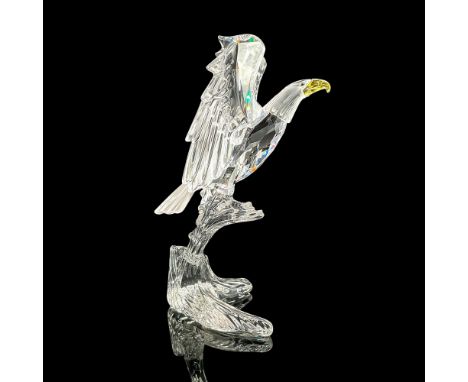 Stunning cut crystal figure of a mighty eagle perched with wings expanded. The beak is yellow. Swarovski etched mark. This it