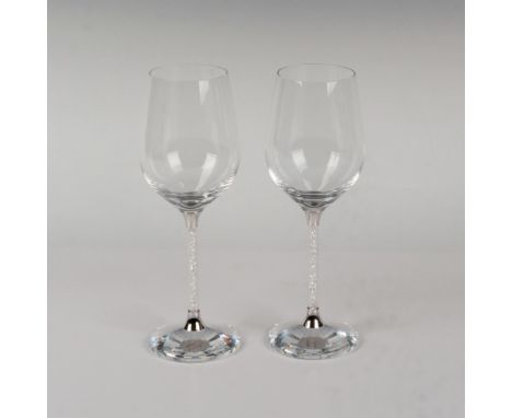 Elegant set of lead crystals part of the Home Accessories ranged and are made with clear crystals that fill the stems. Swarov