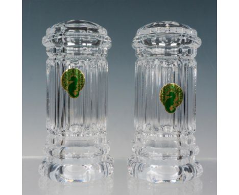 Clear crystal salt and pepper shakers decorated with Georgian designs. Waterford factory label. Waterford etched backstamp. T
