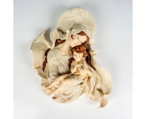 Porcelain figural wall mount depicting the Virgin Mary embracing her child. Florence Giuseppe Armani marked on the side. This