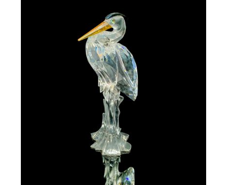 Swarovski crystal heron with an amber beak and black feathers on the top of its head. This item has its original box. Box dim