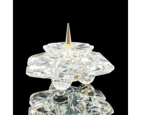Lead crystal made with rhodium center, and was designed to hold one candle. Swarovski etched backstamp. This item has its ori