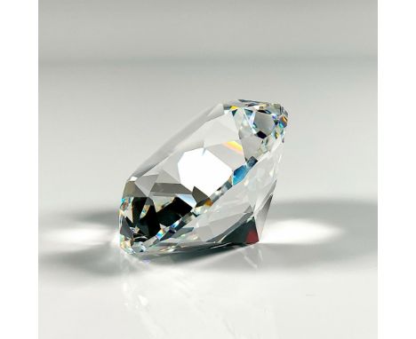 Clear faceted crystal paperweight in the shape of a diamond. Swarovski mark. This item has its original box: 3.75""H x 3.25""
