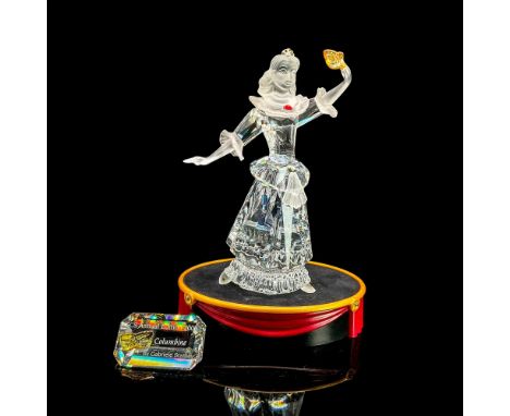 Brilliant clear crystal with arm raised holding mask. Satin head and arms. Swarovski Crystal Society figure. Part of the Masq