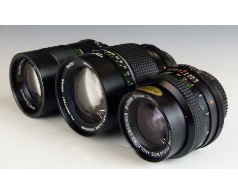 Three Vivitar SLR camera lenses comprising 28mm 1:2.0, 135mm 1:2.8 62mm and 135mm 1:2.8 55mm examples, all with Minolta mount