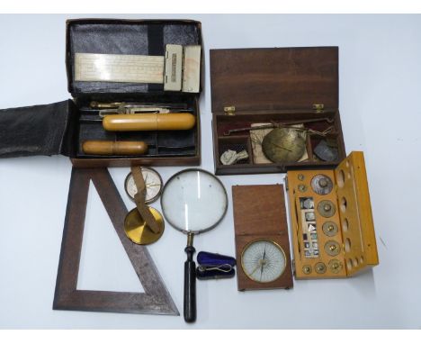 A 19thC set of travelling beam scales, cased set of weights, two compasses, one marked F.Barker &amp; Son London, small Winso