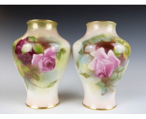 A pair of&nbsp;Royal Worcester pair of baluster vases with hand decoration of roses in the style of Hunt, H 11cm