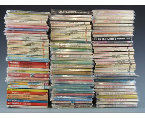 Over 100 collectable paperback books including first editions, Mad, Peanuts, Man From UNCLE etc.&nbsp;
