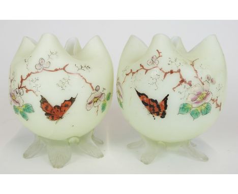 A pair of Stevens and Williams Stourbridge glass vases with enamel butterfly and flower decoration and applied clear feet, 13