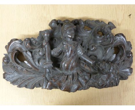 A 17thC carved oak finial, 24x55cm