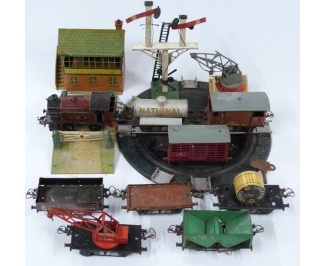 Fourteen Hornby 0 gauge model railway locomotives, wagons, buildings and accessories including LMS 0-4-0 2270 clockwork locom