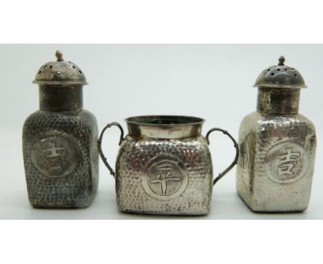 Chinese hammered white metal cruet with Chinese character decoration and impressed marks to base, tallest item 6.8cm