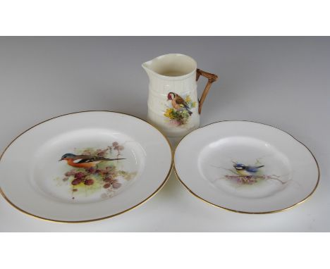 Royal Worcester porcelain plates and jug, all with decoration of garden birds including a chaffinch and goldfinch, the jug si