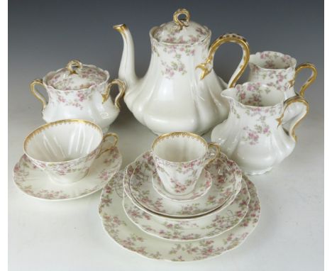 An extensive Limoges tea set including teapot, jugs etc and two Royal Worcester boxed sets of tea cups and saucers