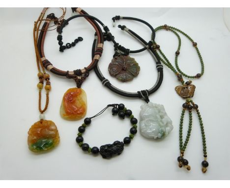 A nephrite jade and tiger's eye necklace, an agate pendant, and a Chinese hardstone bracelet depicting a foo dog, Two Chinese