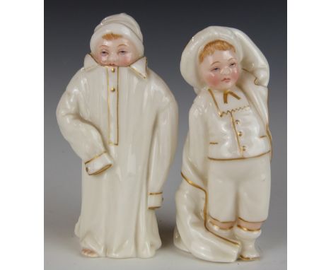 Two Royal Worcester Kate Greenaway candle snuffers with puce marks, H10cm