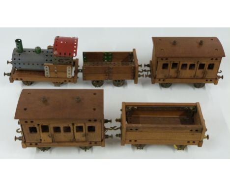 Meccano or Butcher &amp; Sons Primus model of a train comprising locomotive, two coaches and two wagons, made using red, gree