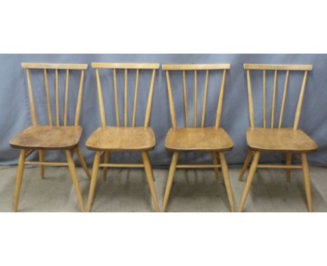 Four Ercol light elm comb back chairs