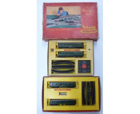 Two Tri-ang 00 gauge model railway train sets together with an empty Tri-ang No.1 Passenger set box.&nbsp;