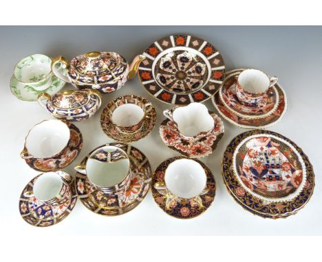 A collection of Royal Crown Derby Imari 2451 and 1128 pattern teaware, Copeland Imari teaware, Wileman/Foley (later Shelley) 