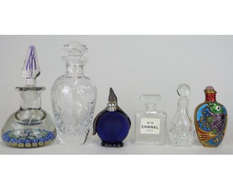 Five glass scent bottles including an English millefiori, Chanel No.19, one with white metal penguin etc together with a Chin