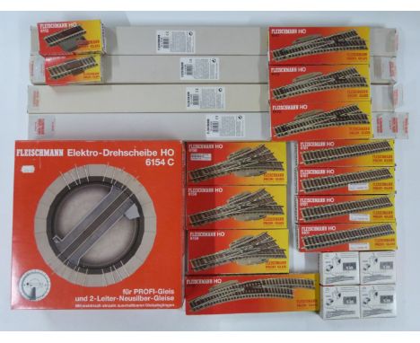 A collection of Fleischmann 00 gauge model railway track, points and a turntable, all in original boxes.&nbsp;