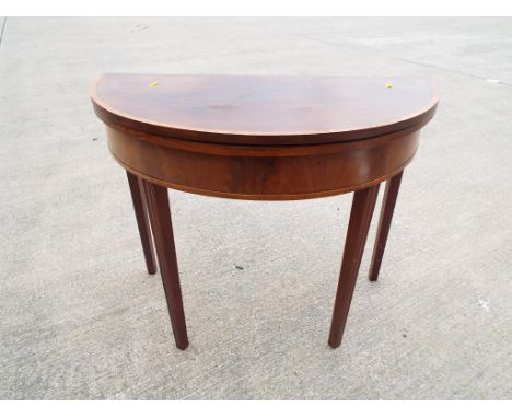 A good quality mahogany half moon card table