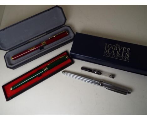 Three fountain pens comprising Harvey Makin white metal pen with cartridge, PN9000 with green marbled barrel and red barrelle