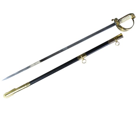 A 20th Century ceremonial dress sword with Malaysian Armed Forces insignia. The sword with a brass dragons head to the pommel