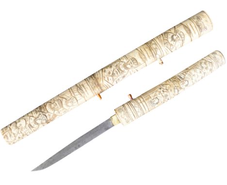 An early 20th Century Japanese Tanto knife / dagger with bone scrimshaw handle and scabbard. Extensively carved to depict Jap